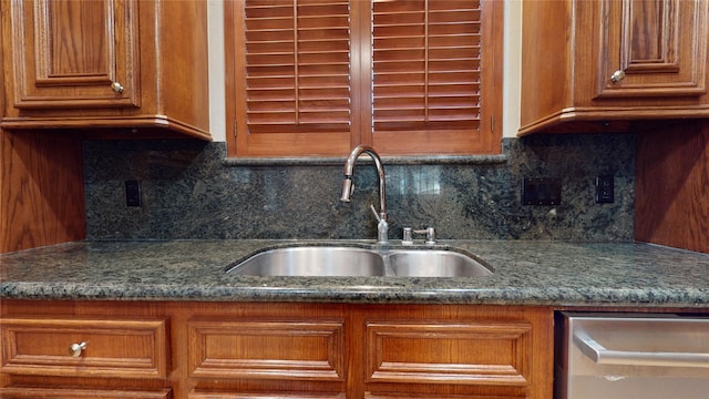 kitchen with dishwasher, tasteful backsplash, and sink