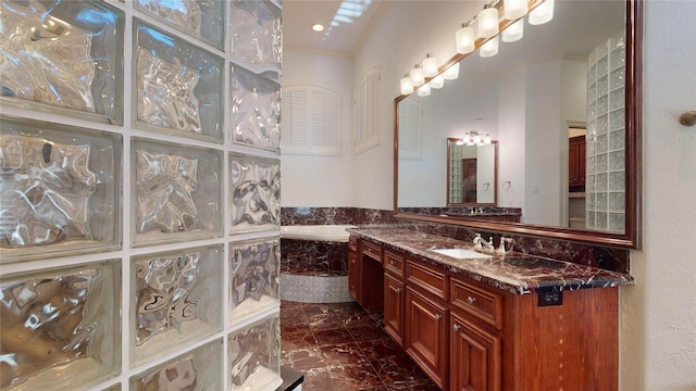 bathroom featuring a washtub and vanity