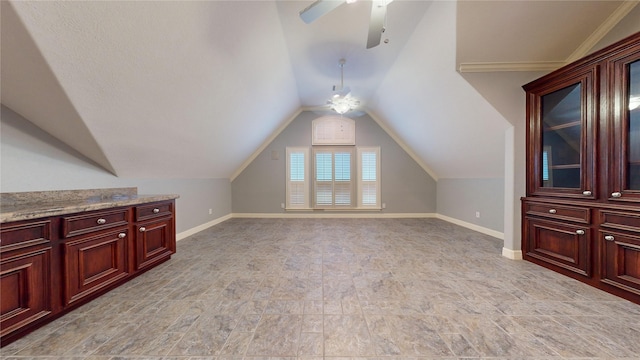 additional living space featuring vaulted ceiling and ceiling fan