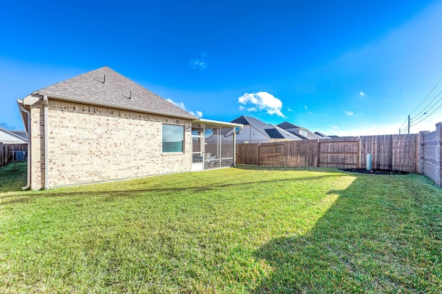 view of yard featuring a sunroom