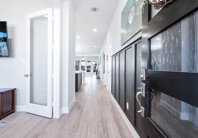 hallway featuring light hardwood / wood-style floors