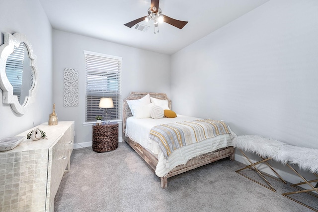 bedroom with ceiling fan and light colored carpet