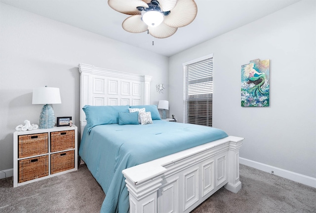 bedroom with ceiling fan and light carpet