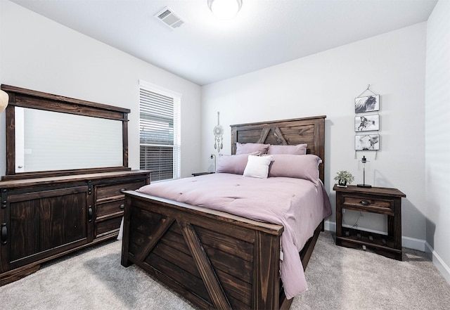 bedroom featuring light colored carpet