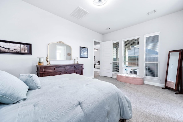 bedroom featuring light colored carpet