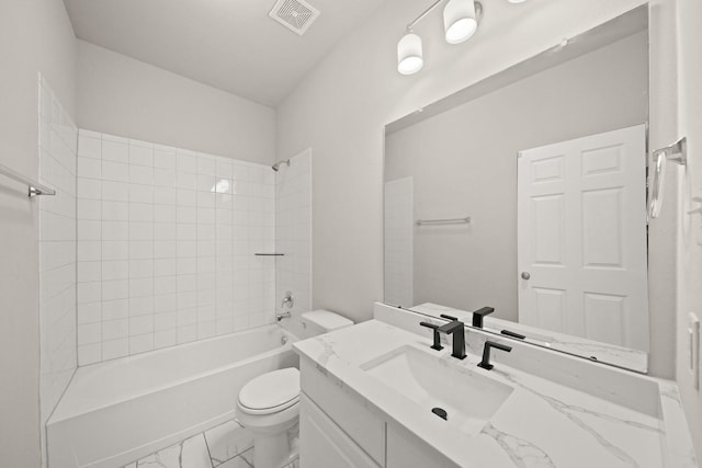 full bathroom with vanity, tiled shower / bath combo, and toilet