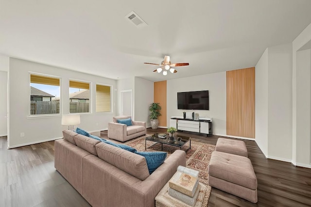 living room featuring hardwood / wood-style flooring and ceiling fan