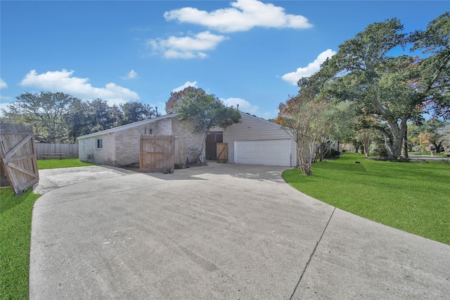 view of front of house featuring a garage and a front lawn