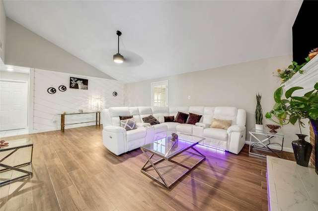 living room with wood-type flooring and lofted ceiling