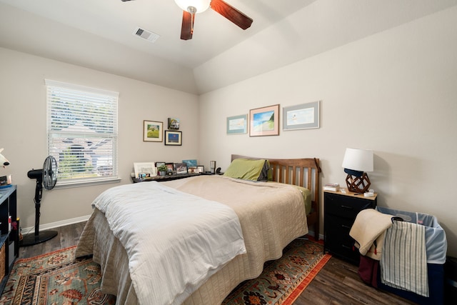 bedroom with vaulted ceiling, ceiling fan, and dark hardwood / wood-style floors