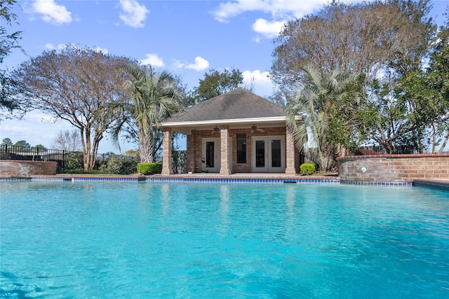 view of pool with an outdoor structure