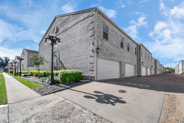 view of side of home with a garage