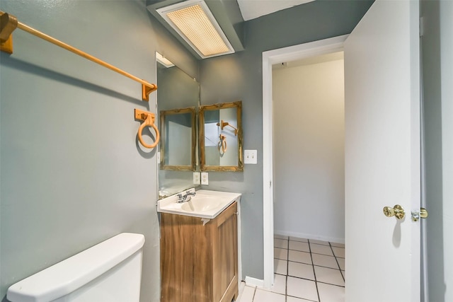 bathroom featuring tile patterned floors, vanity, and toilet