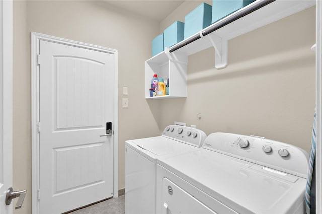 laundry area with washing machine and clothes dryer