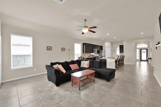 living room featuring ceiling fan