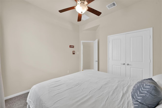 bedroom with carpet flooring, ceiling fan, lofted ceiling, and a closet