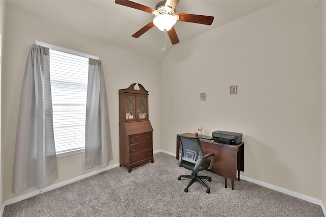 home office with ceiling fan and light carpet