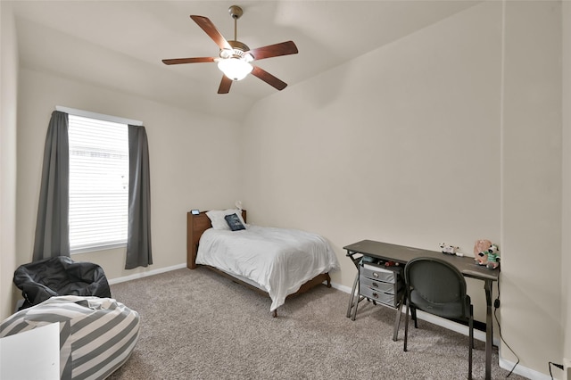 carpeted bedroom featuring ceiling fan and vaulted ceiling