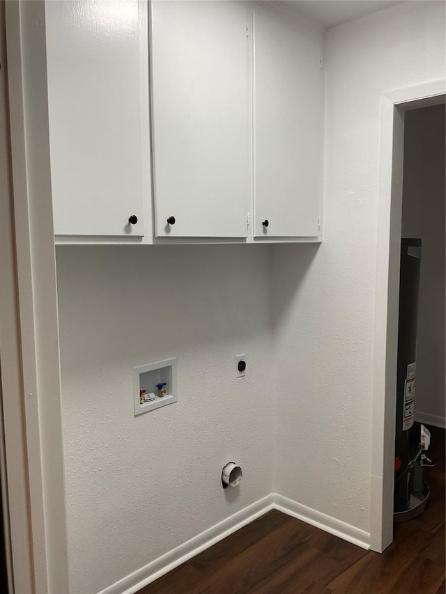 laundry room with water heater, dark hardwood / wood-style flooring, cabinets, washer hookup, and hookup for an electric dryer