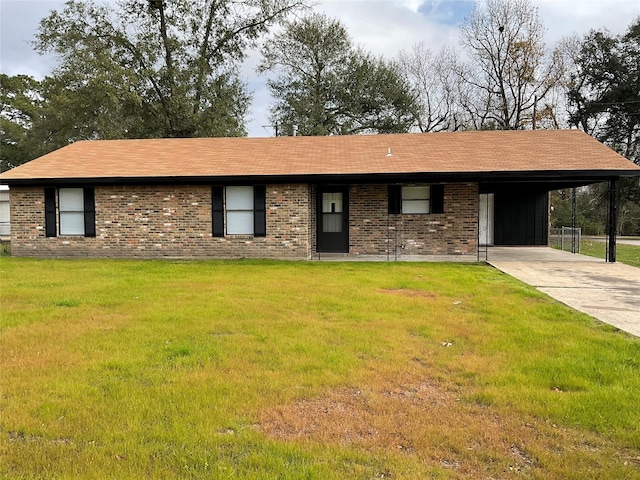 ranch-style house with a front yard and a carport