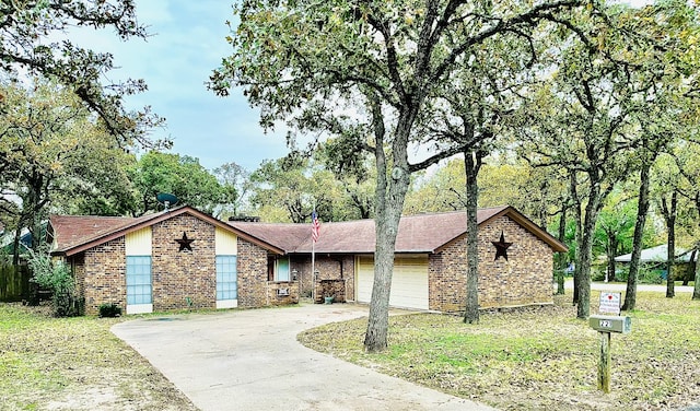 ranch-style home featuring a garage