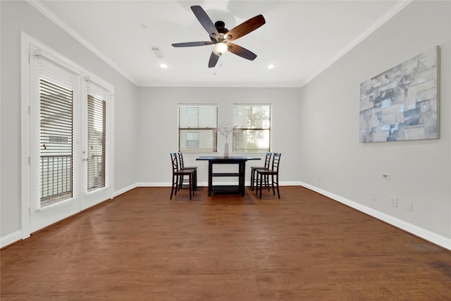 dining room featuring ceiling fan, crown molding, and a wealth of natural light