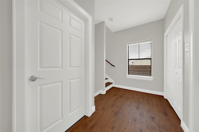 hallway with dark hardwood / wood-style floors