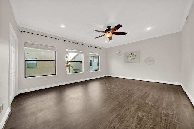 unfurnished room featuring ceiling fan, dark hardwood / wood-style flooring, and crown molding