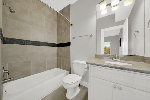 full bathroom with tile patterned floors, tiled shower / bath combo, toilet, and vanity