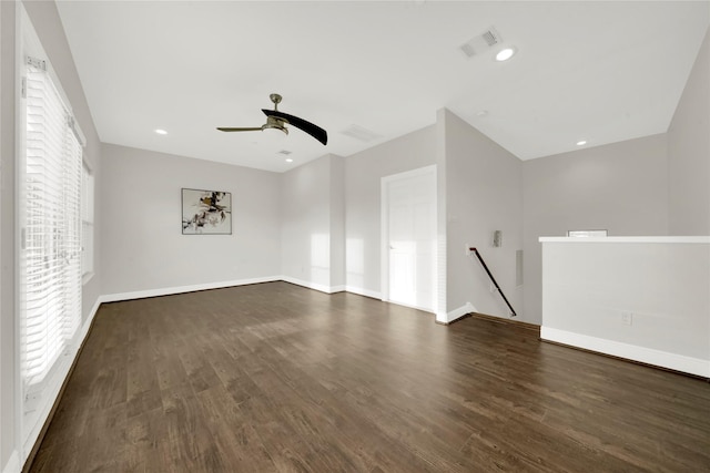 unfurnished room featuring ceiling fan and dark wood-type flooring