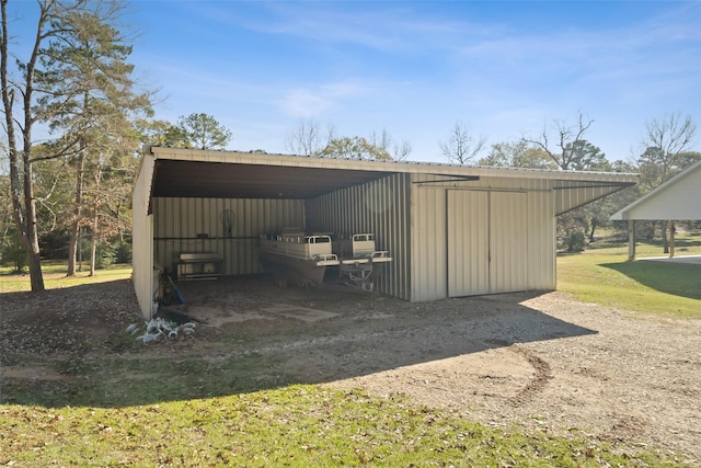 view of outbuilding featuring a yard