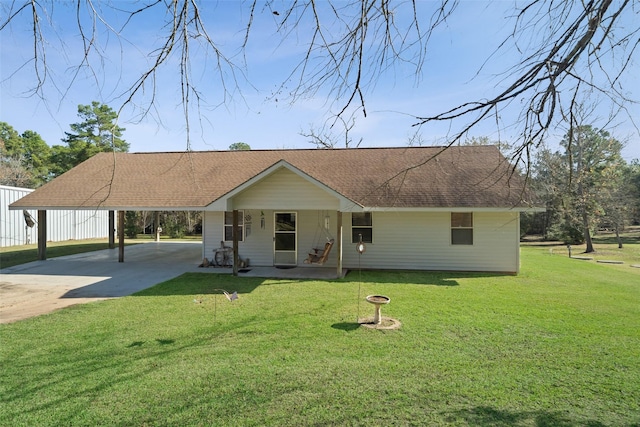 ranch-style house with a front yard, a porch, and a carport