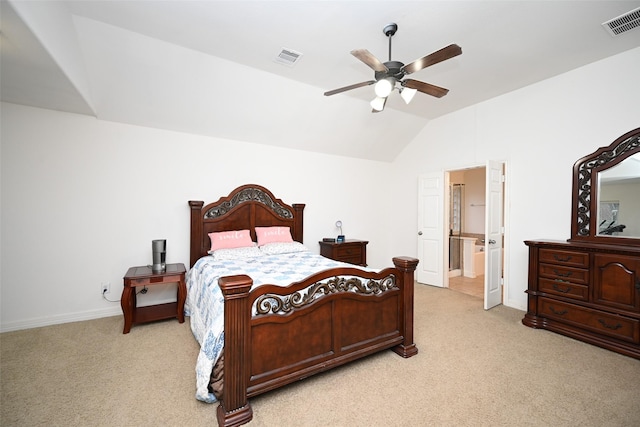 carpeted bedroom featuring ceiling fan, lofted ceiling, and ensuite bathroom