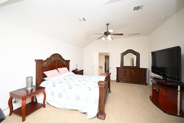 bedroom with ceiling fan, light colored carpet, and vaulted ceiling