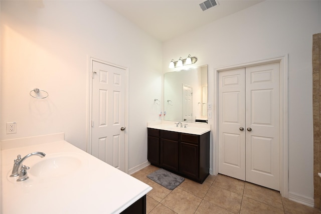 bathroom featuring tile patterned floors and vanity