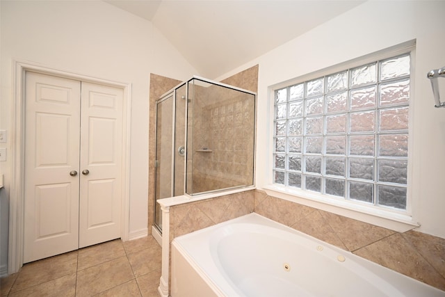 bathroom featuring tile patterned flooring, plus walk in shower, and vaulted ceiling