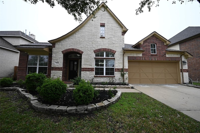 french provincial home with a garage