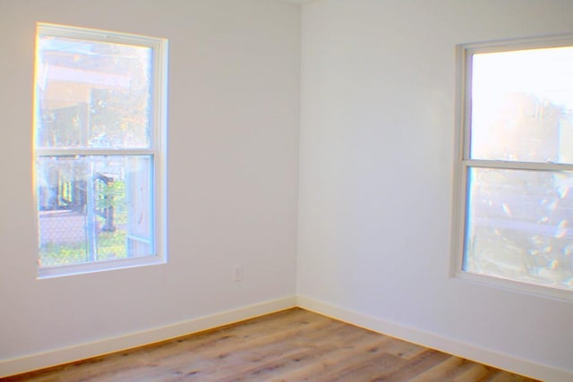 spare room with light hardwood / wood-style floors