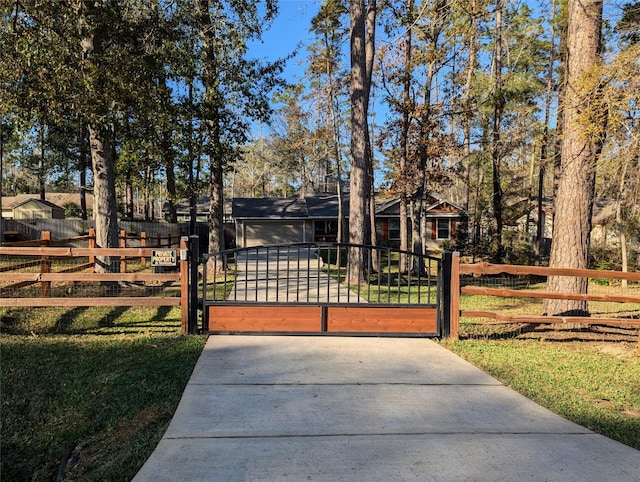 view of front of home featuring a front lawn and a garage