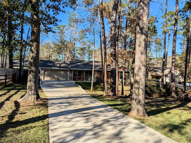 ranch-style house with a front yard and a garage