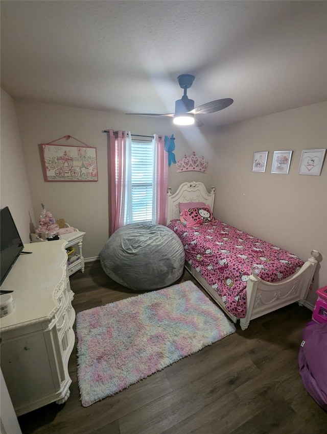 bedroom featuring ceiling fan and dark hardwood / wood-style floors