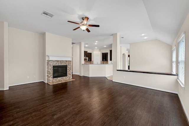 unfurnished living room with dark hardwood / wood-style floors, ceiling fan, and lofted ceiling