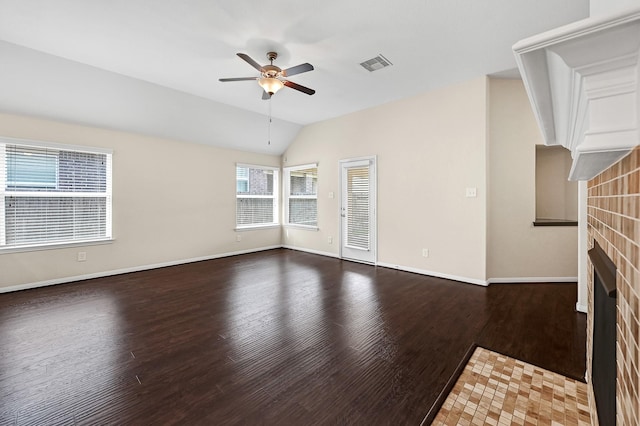 unfurnished living room with a fireplace, hardwood / wood-style flooring, vaulted ceiling, and ceiling fan