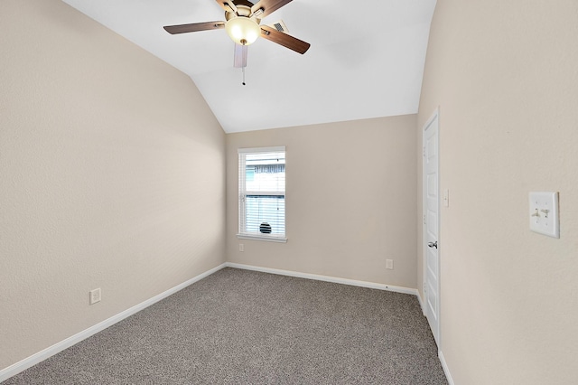 empty room featuring carpet, ceiling fan, and lofted ceiling