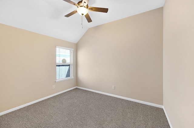 carpeted empty room featuring ceiling fan and lofted ceiling