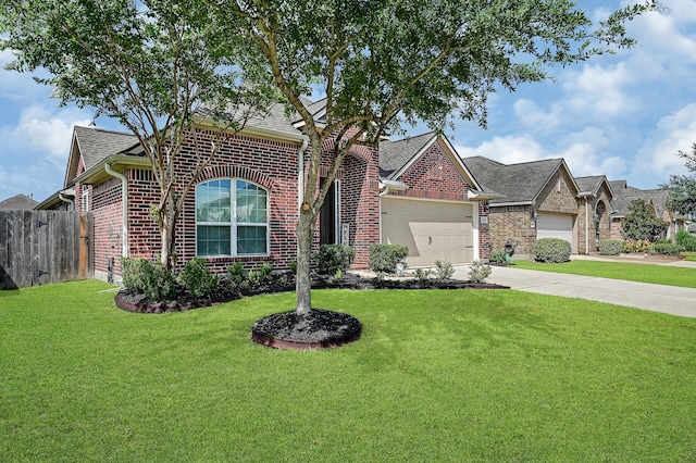 view of front of property featuring a front yard and a garage