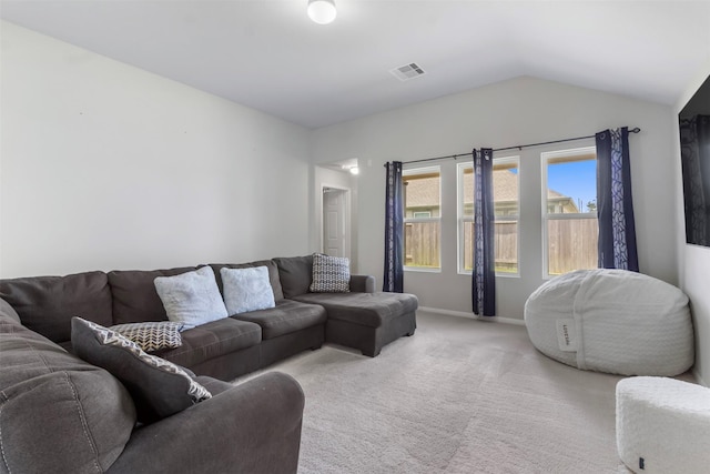 living room featuring vaulted ceiling and light carpet