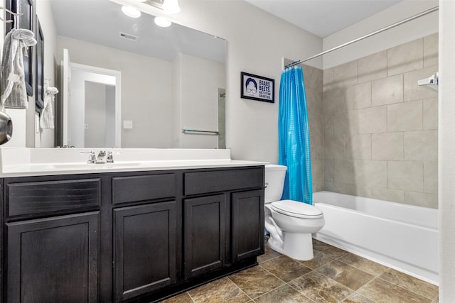 full bathroom featuring toilet, vanity, and shower / bath combo