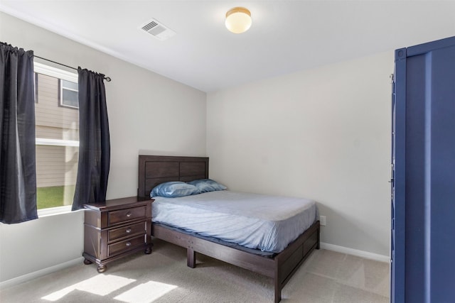 bedroom with light carpet