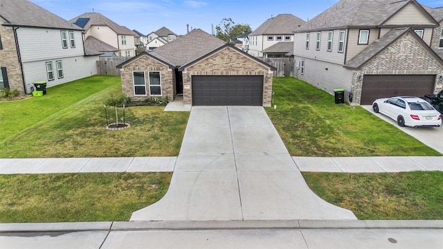 view of front of home featuring a front yard and a garage